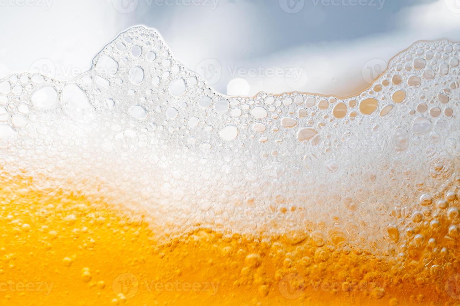 Close up bright orange Oil or beer splash texture and nature waves, Beautiful waves curve and little bubbles smooth for graphic design and background, Oil Bubb. photo