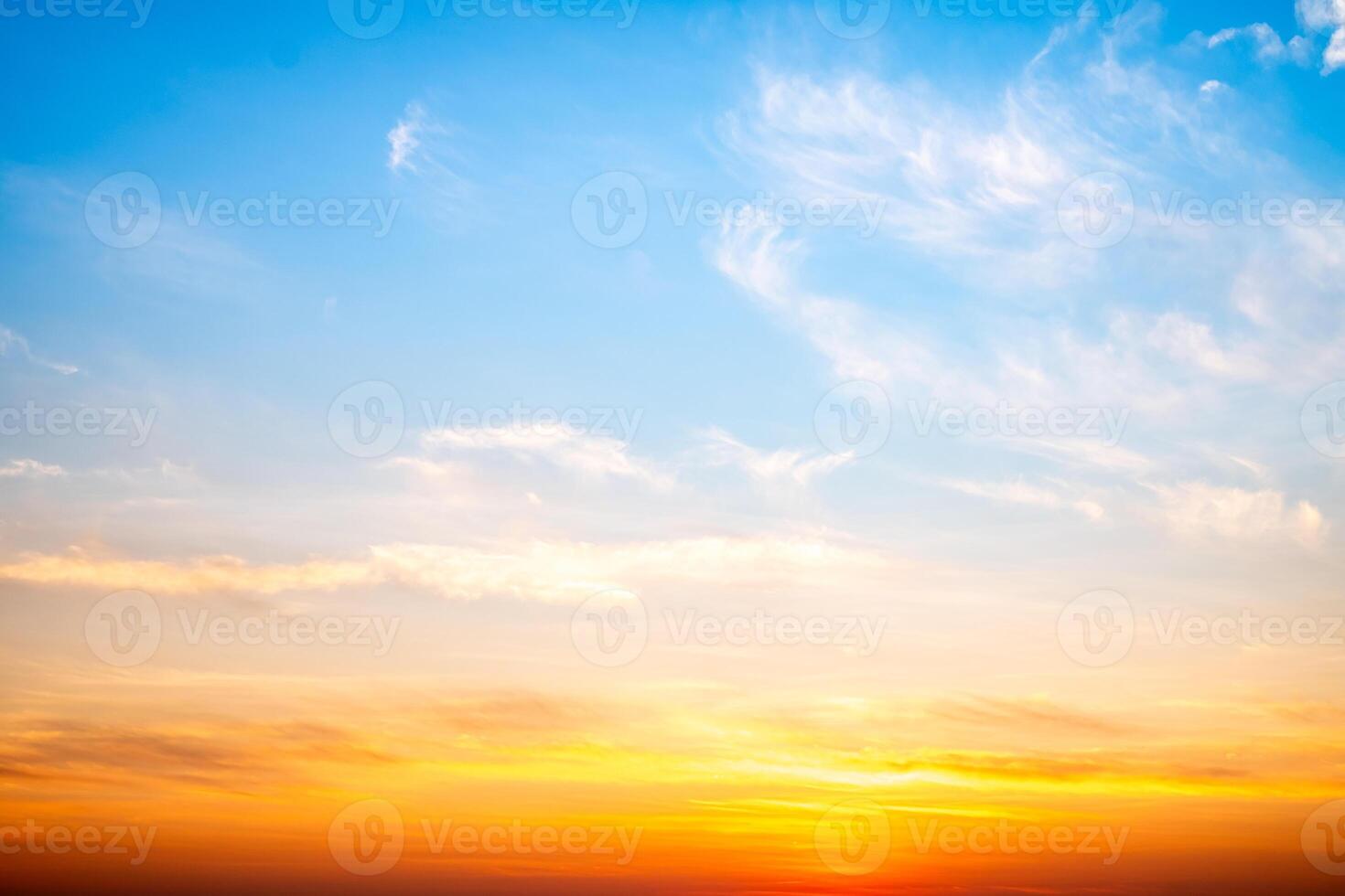 Beautiful , luxury soft gradient orange gold clouds and sunlight on the blue sky perfect for the background, take in evening,Twilight, Large size, high definition landscape photo. photo