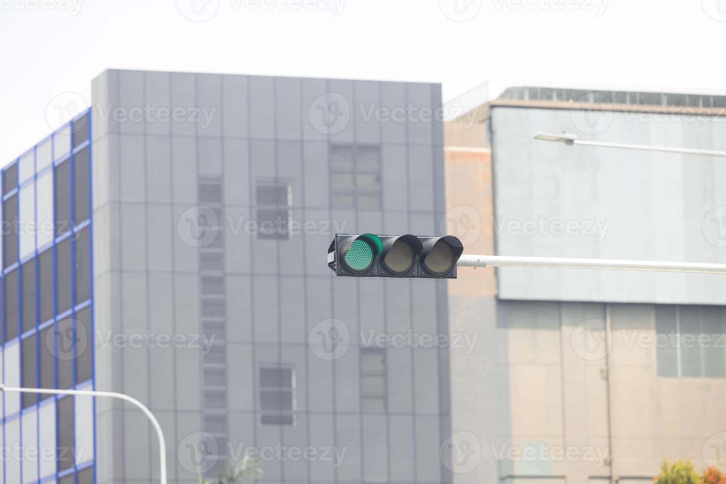 The green traffic light flickered, signaling to prepare for the imminent change photo