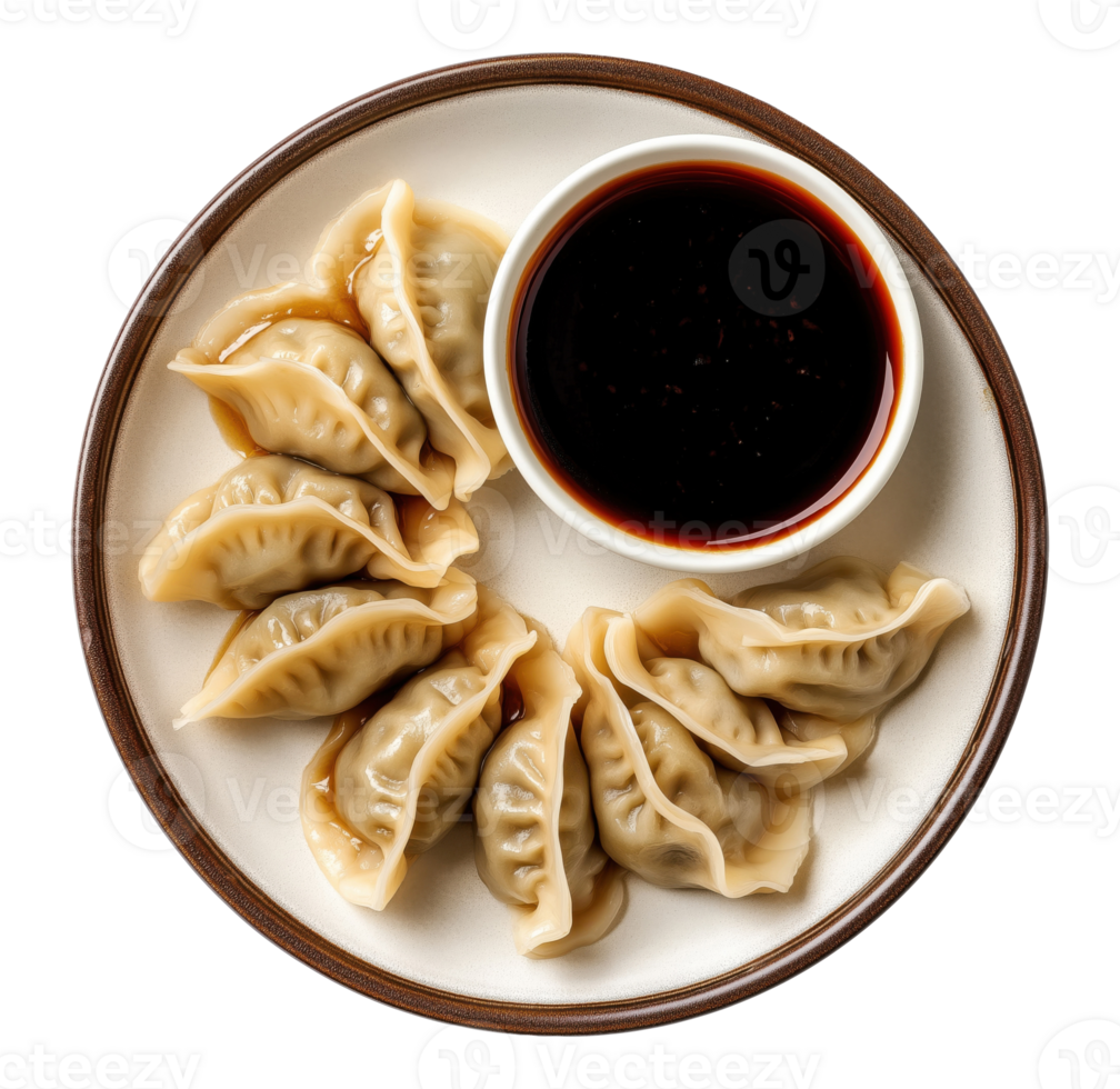 Traditional steamed dumplings arranged in circle on white plate with dark soy sauce, isolated on a transparent background png