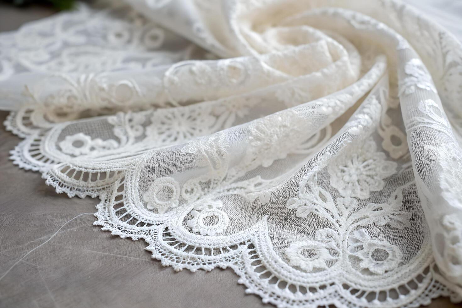 Elegant white lace fabric featuring detailed floral embroidery and delicate scalloped edges, high-quality craftsmanship photo