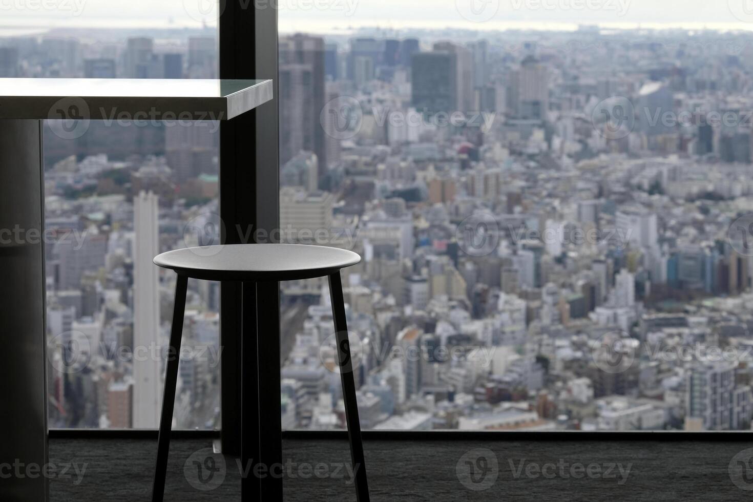 Bar stool with a view over the skyline of Tokyo, Japan photo