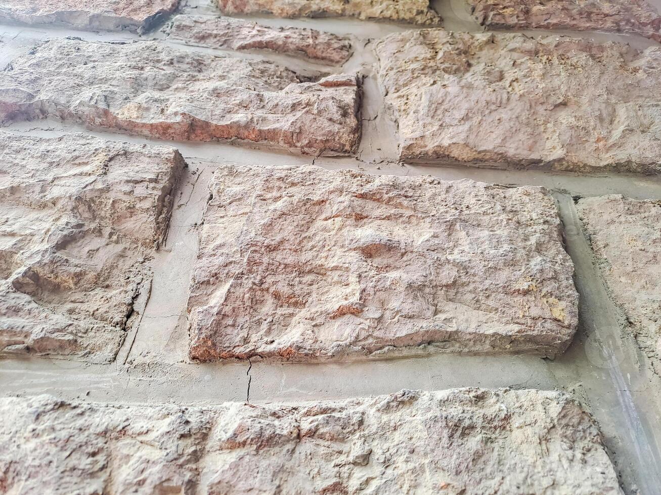 Old stone pink Tuff bricks, textures for designers, background wallpaper photo
