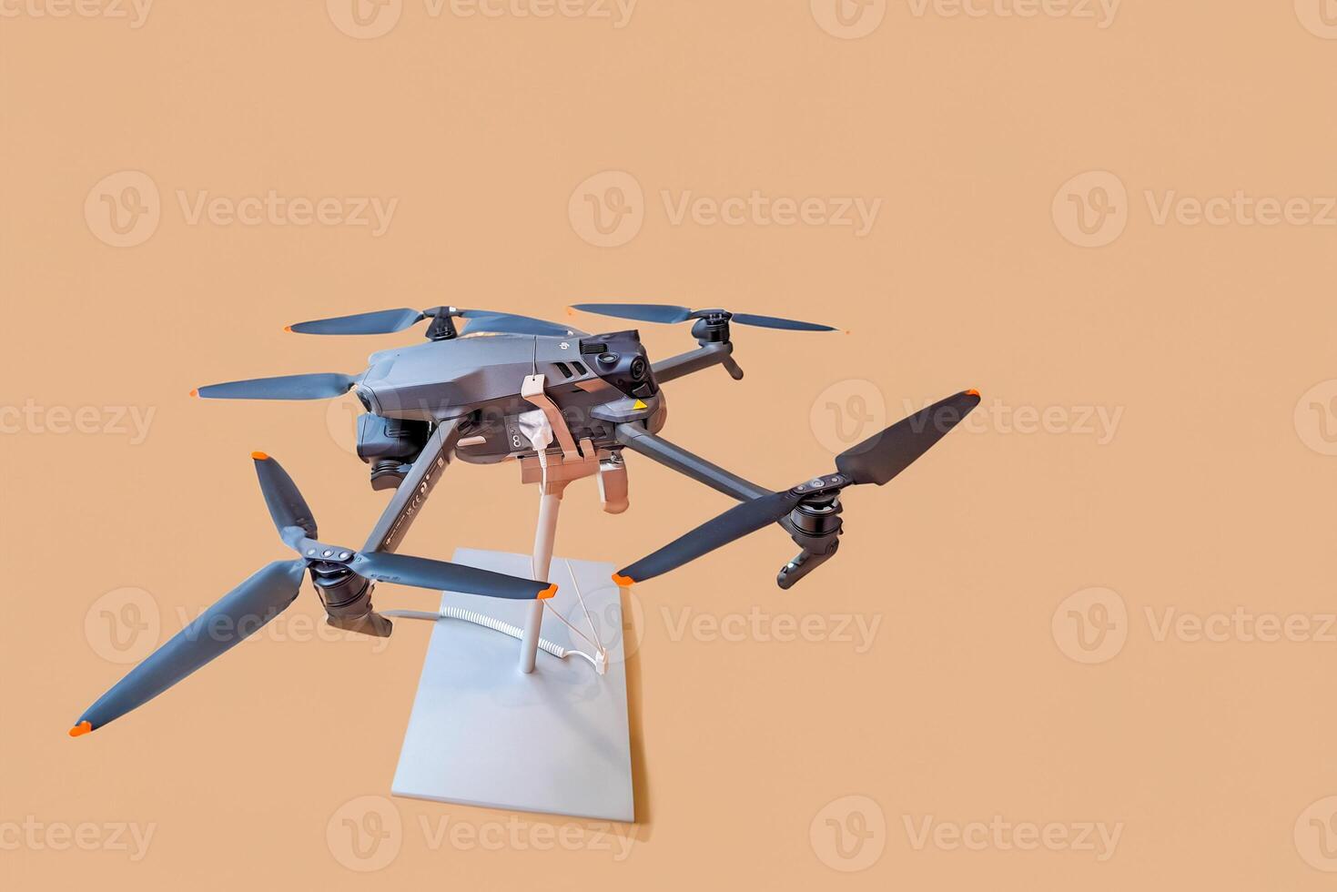 small automatic electronic drone with camera and four propellers. Modern drone photo
