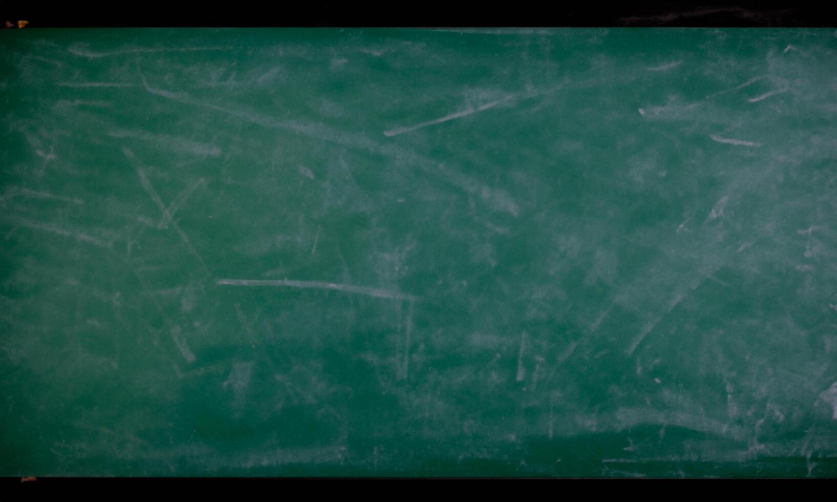 School board with chalk written on it, no writing, free space for texts green photo