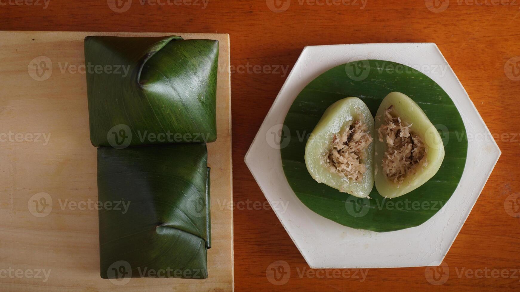 Kue Bugis, popular traditional Indonesian snack dessert made from glutinous rice flour on wooden platter photo
