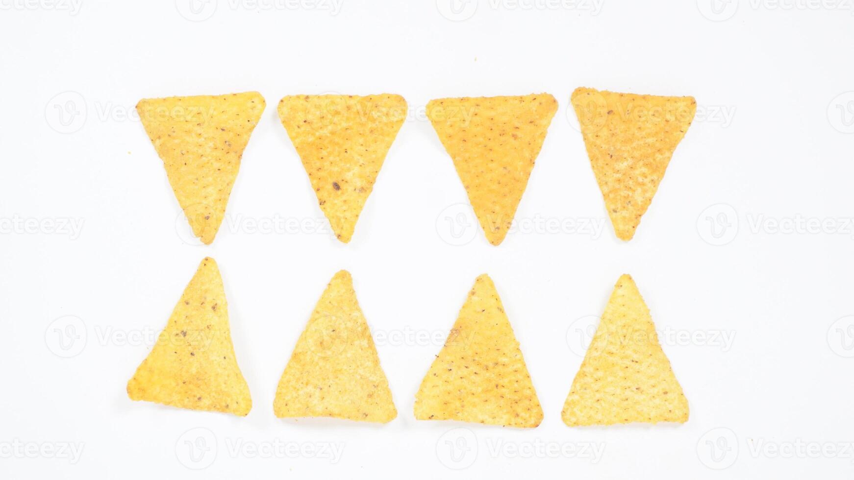 Crispy tortilla chips pattern isolated on white background photo