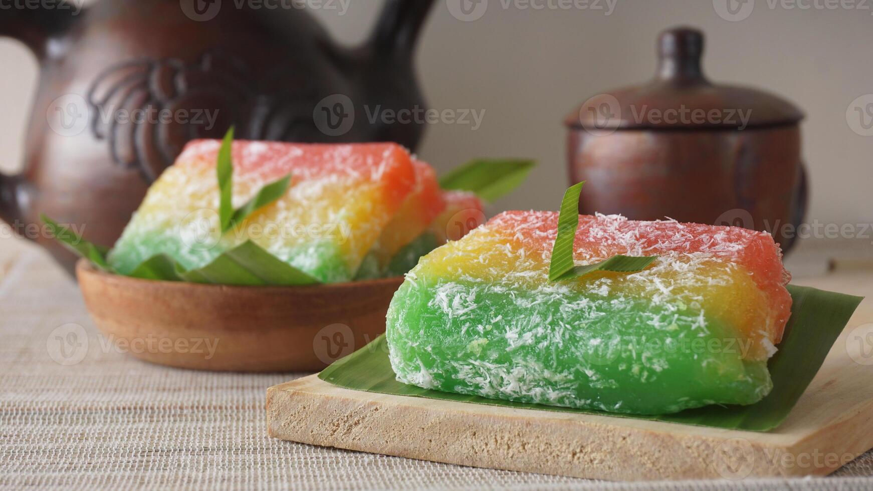 Tasty traditional Indonesian snack called Ongol-ongol on wooden plate photo
