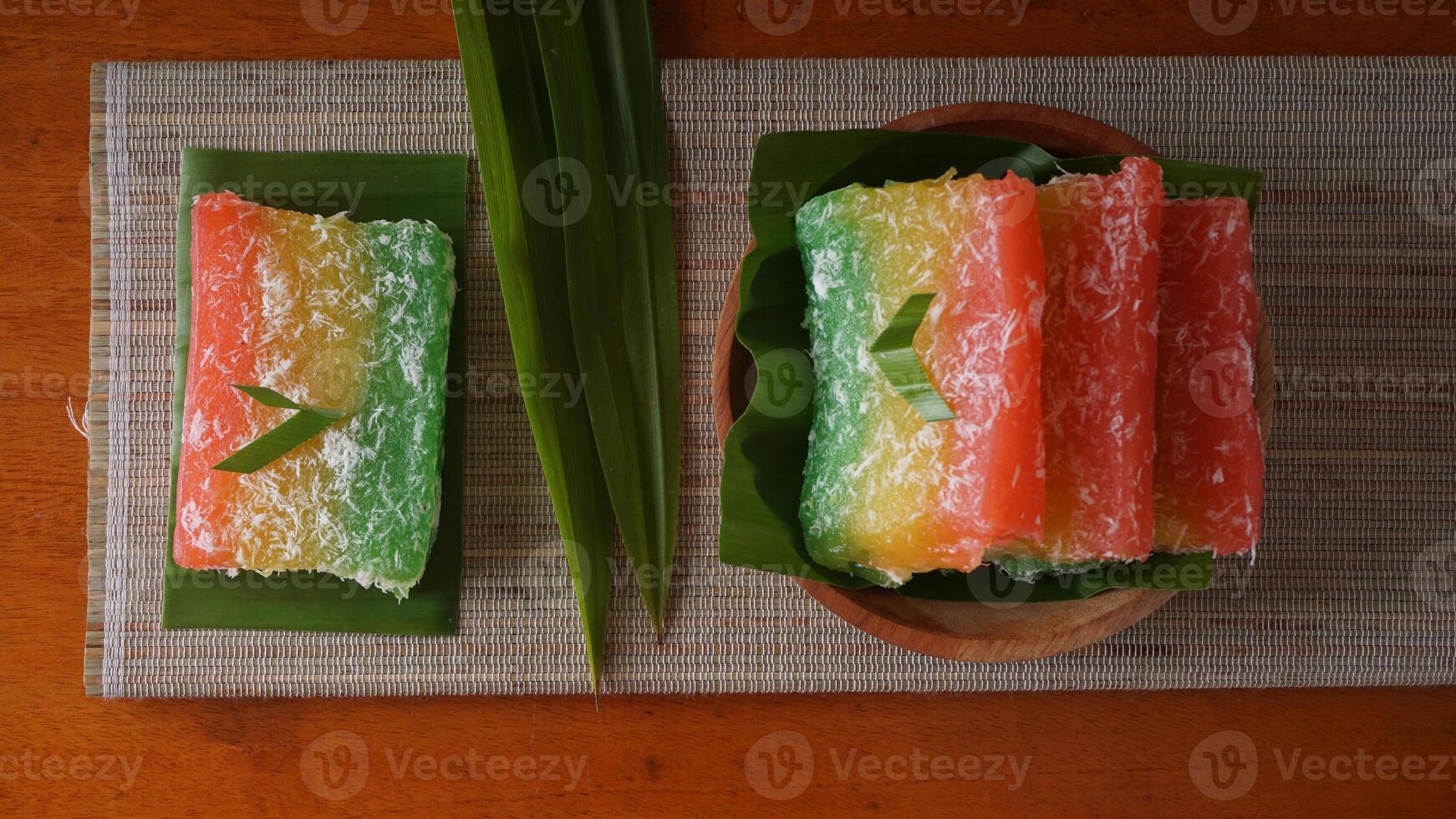 Delicious traditional Indonesian snack with chewy texture called Ongol-ongol on wooden plate photo