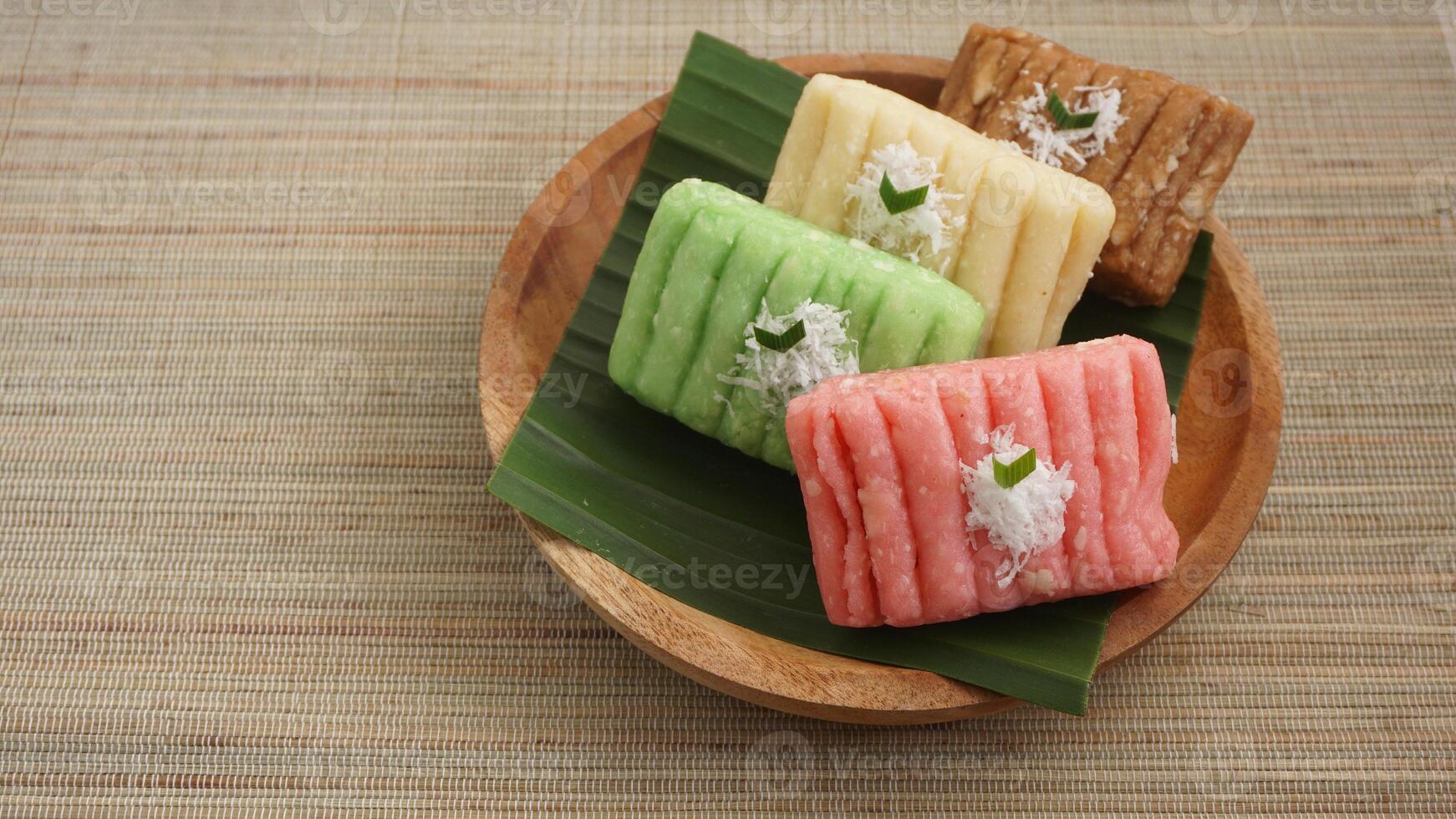 Gethuk, a colorful traditional Indonesian snack made from steamed and mashed cassava with grated coconut topping photo