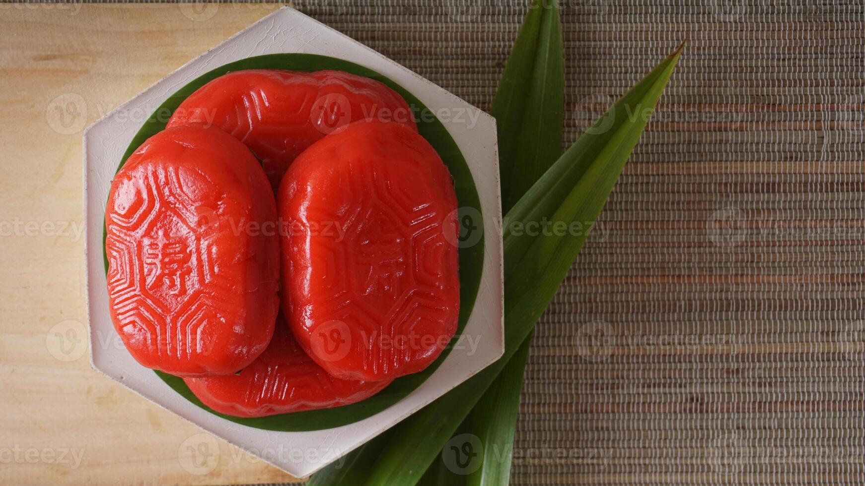 Top view of Kue Mata Kebo means buffalo eye cake, traditional Indonesian snack made from glutinous rice flour, on white platter photo