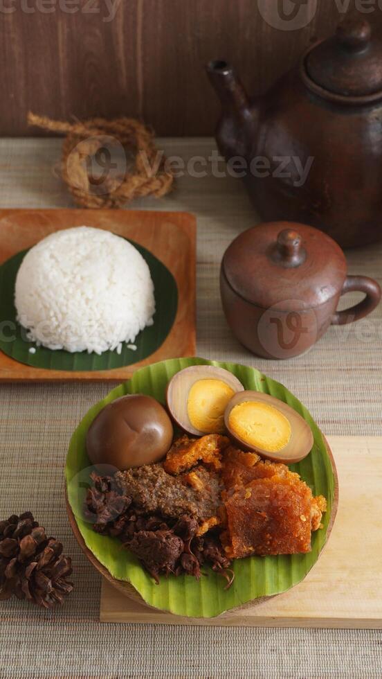 Gudeg, a specialty traditional Javanese dish from Yogyakarta, Indonesia, made primarily from young unripe jackfruit or nangka with several side dishes photo