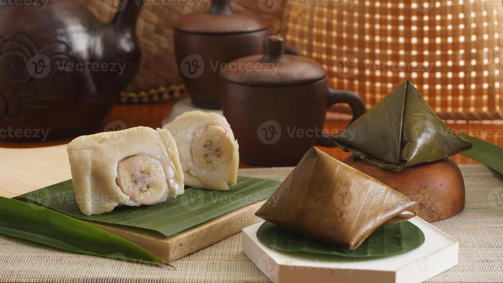 Selective focus of Nogosari, a traditional Indonesian steamed snack made from rice flour, coconut milk, and banana, wrapped in banana leaves photo