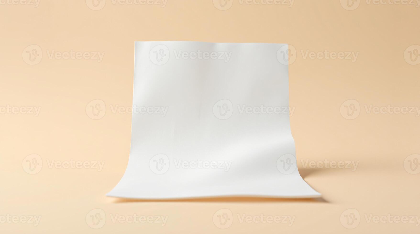 A white sheet of paper isolated against a cream colored background. photo