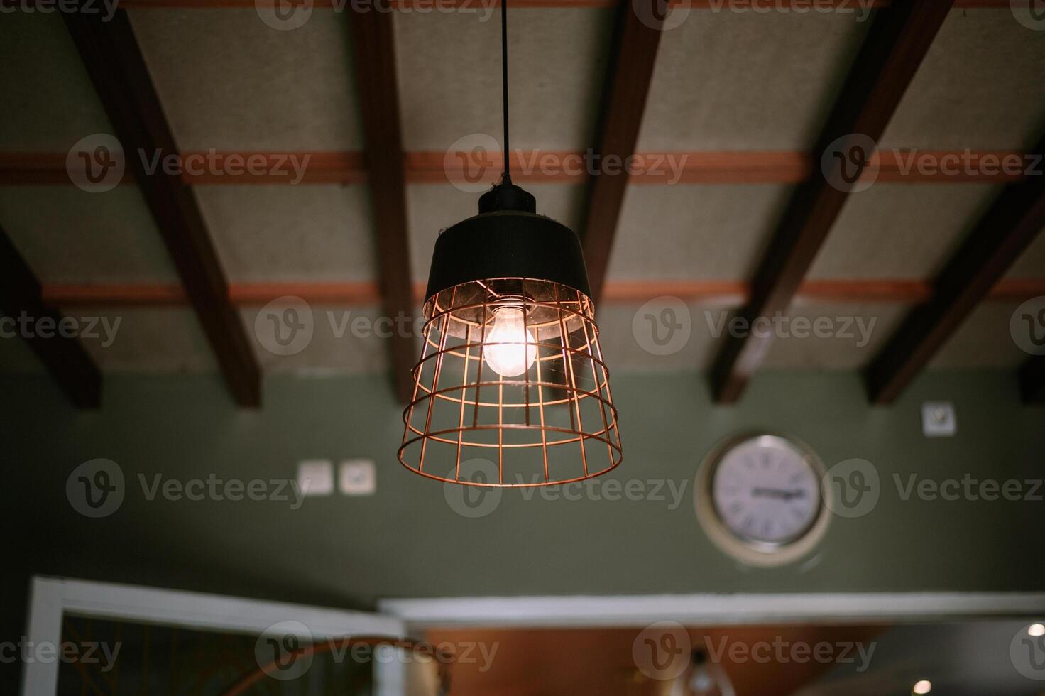 Pendant Light Fixture with Filament Bulb and Interior Design Element photo