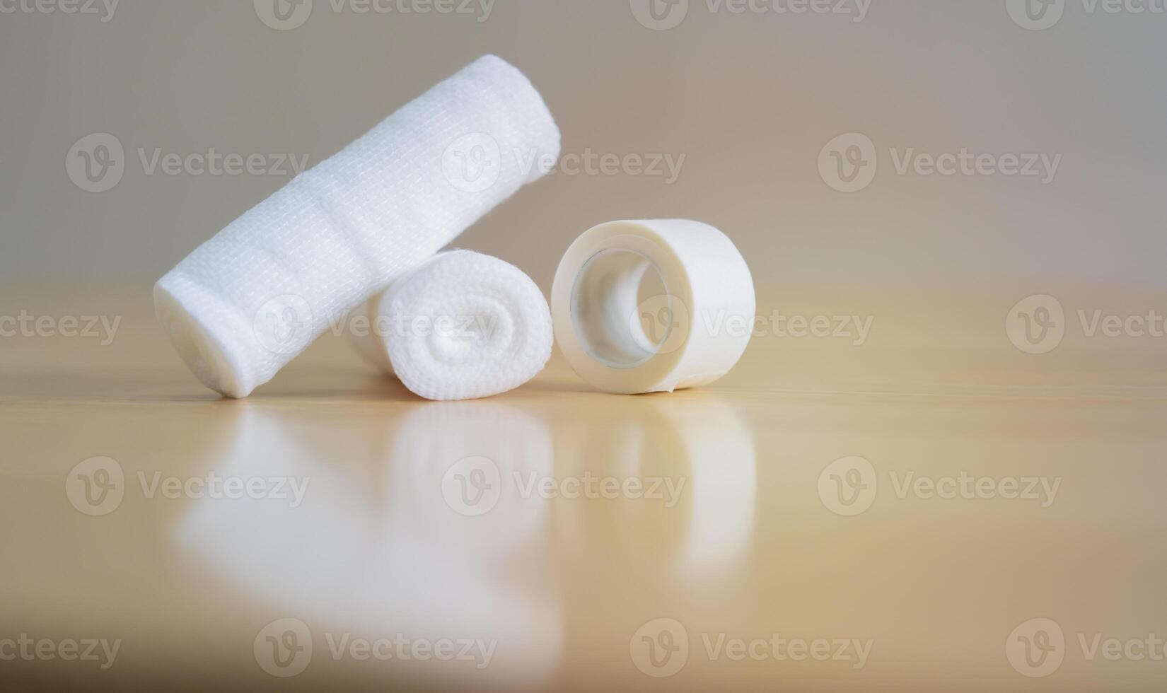 Side view of clean cotton gauze bandage on wooden table with copy space photo