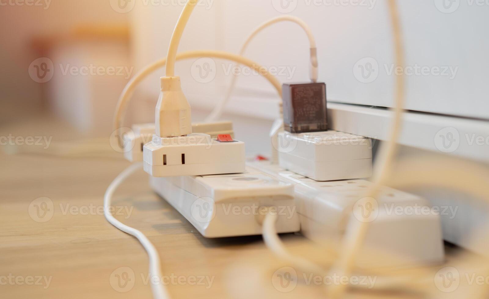 Cropped shot of the power plug, Multiple socket with connected plugs. photo