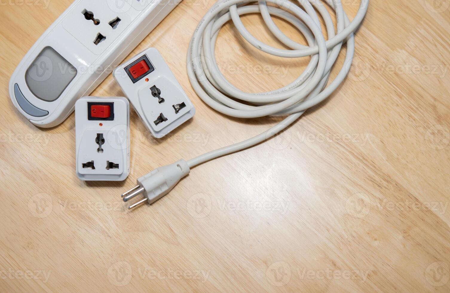 White power extension lead with multiple sockets on wooden table. photo