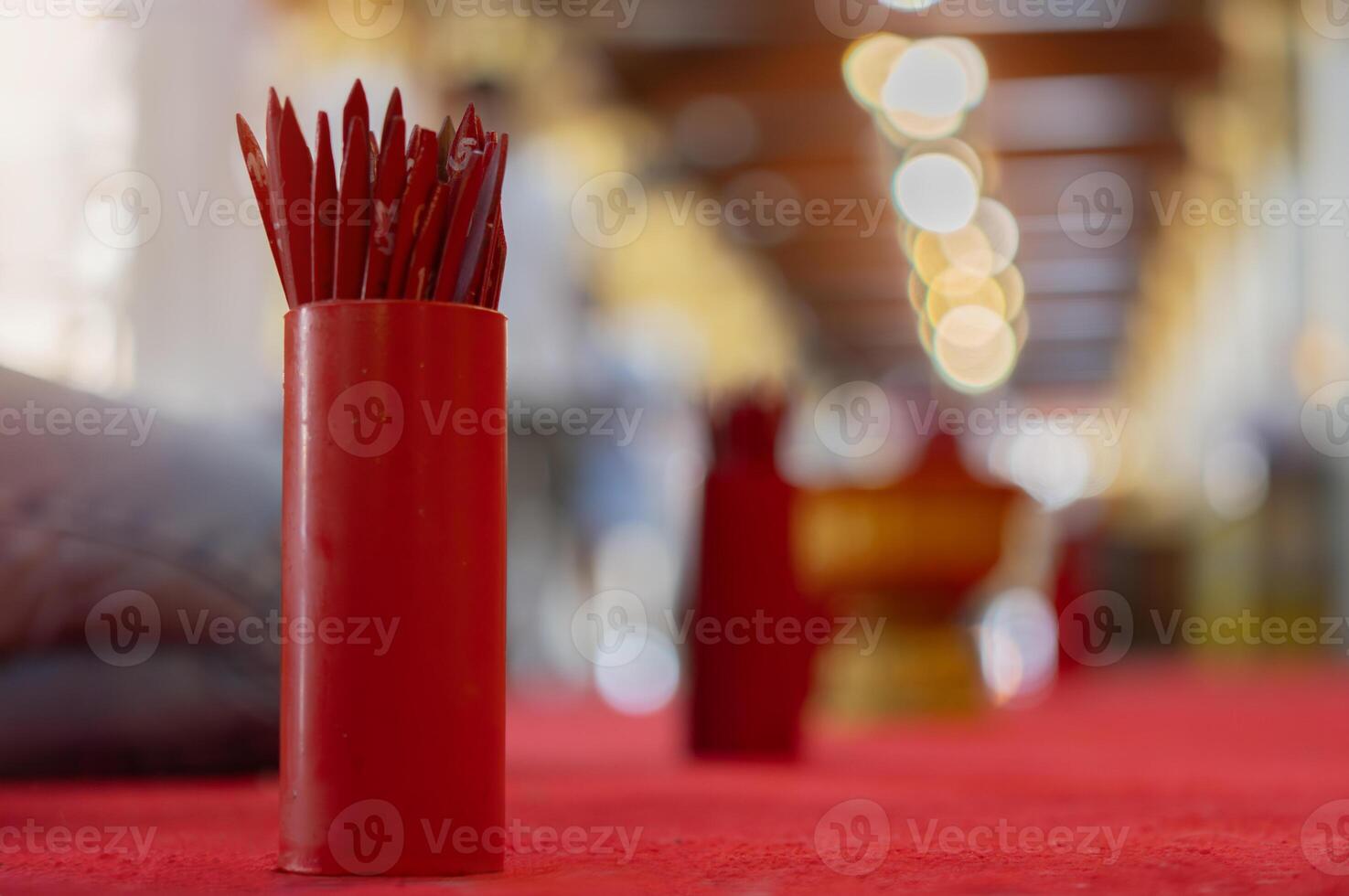 Chinese red bamboo fortune sticks with numbers, shake for future predict in the temple. photo