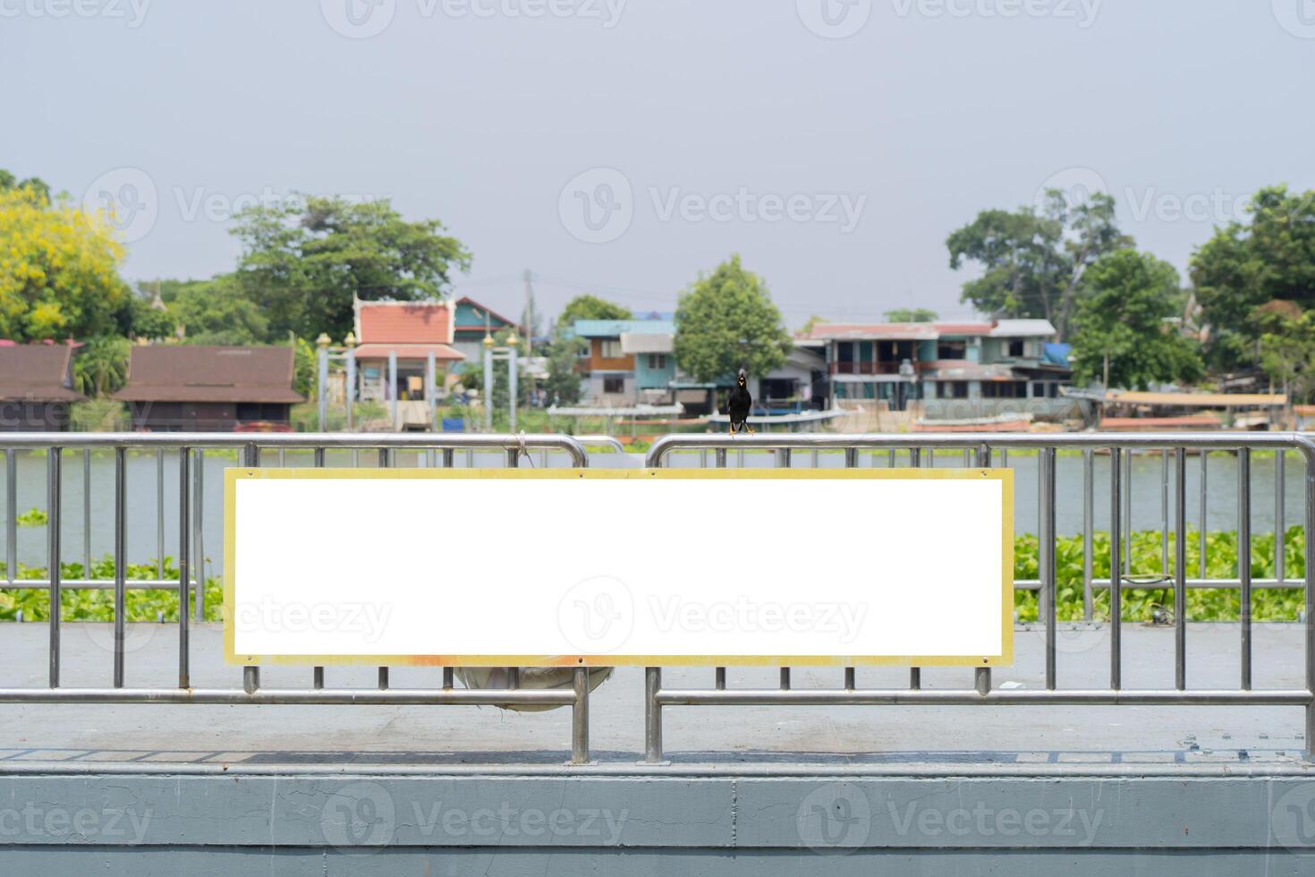 Blank large horizontal sign in front of the river bay. River bay with a blank sign for your text. photo