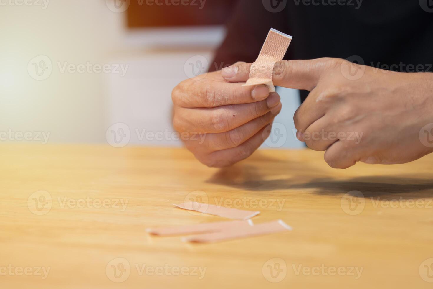 Fingers wrapped in wound healing bandages. The index finger is bandaged because it was injured. photo