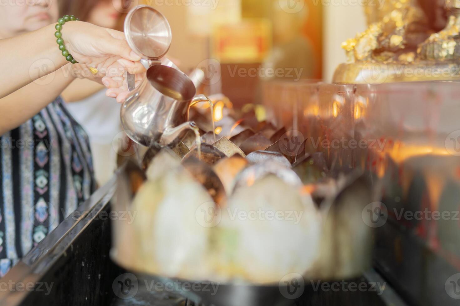 People go to temple add the oil to merit gas lamp to pay homage to Buddha for worship photo