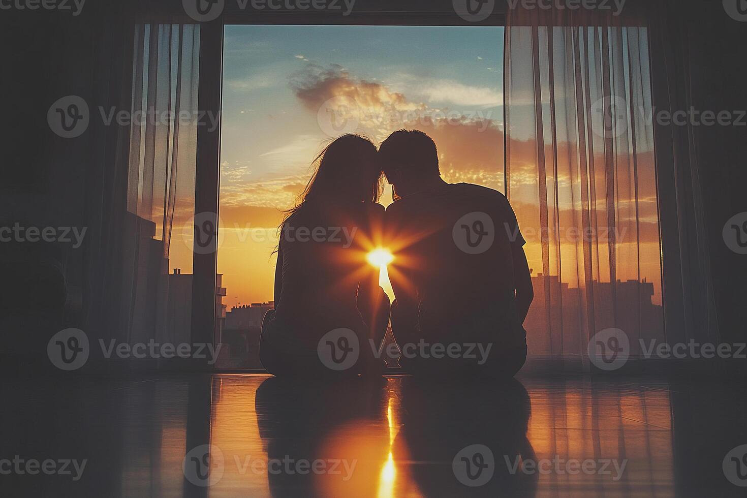 Silhouette of a couple enjoying a romantic sunset while sitting by the window photo
