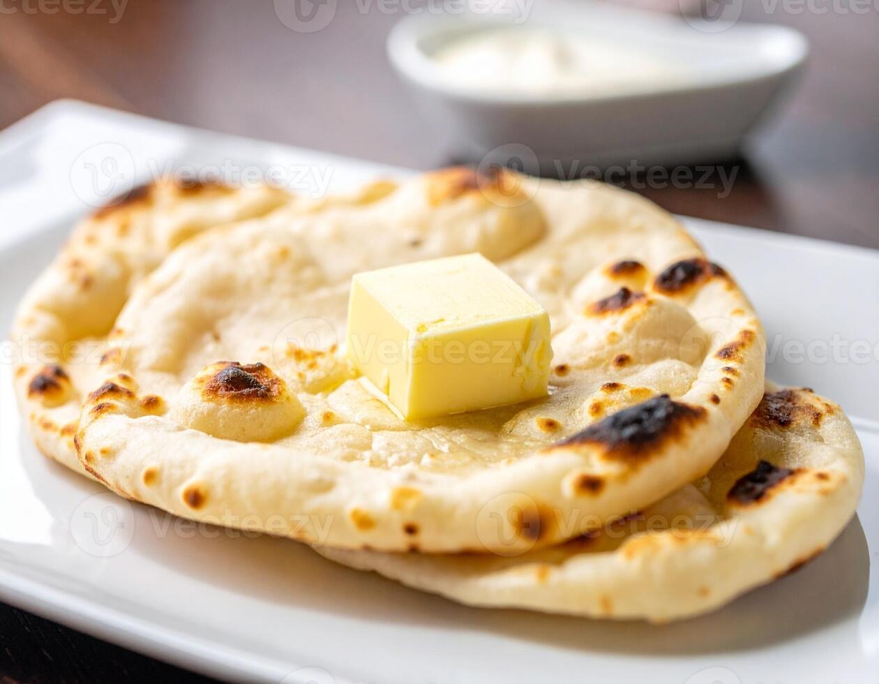 Perfectly Soft and Puffed-Up Tandoori Roti with a Dollop of Butter photo