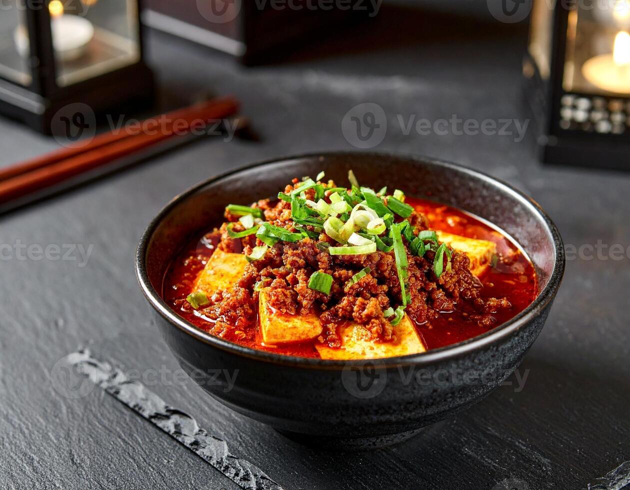 Mapo Tofu with Vibrant Sauce and Minced Meat in a Deep Bowl photo