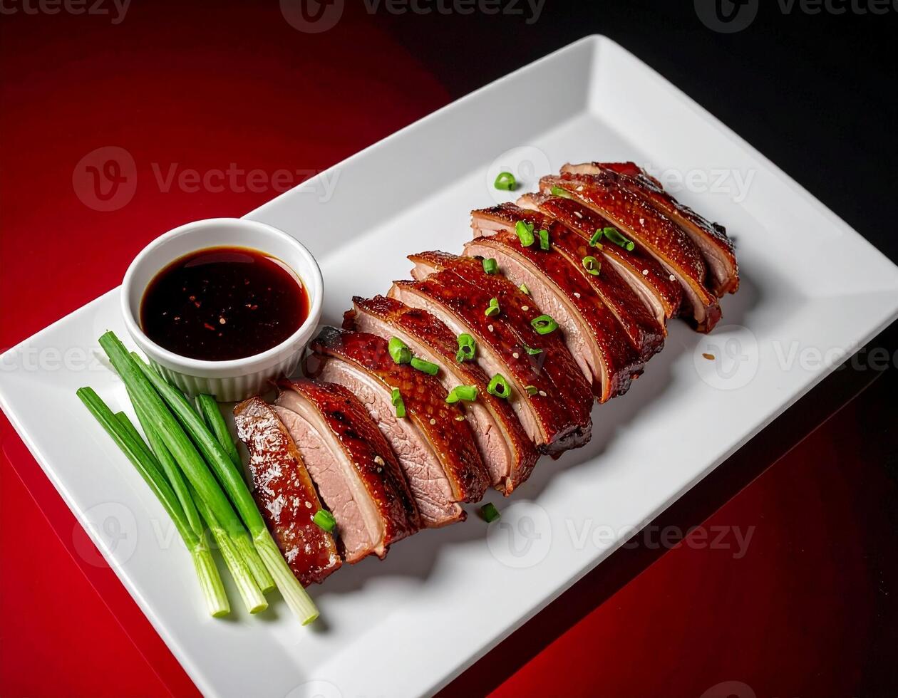 Exquisite Peking Duck Slices on a Rectangular White Platter photo