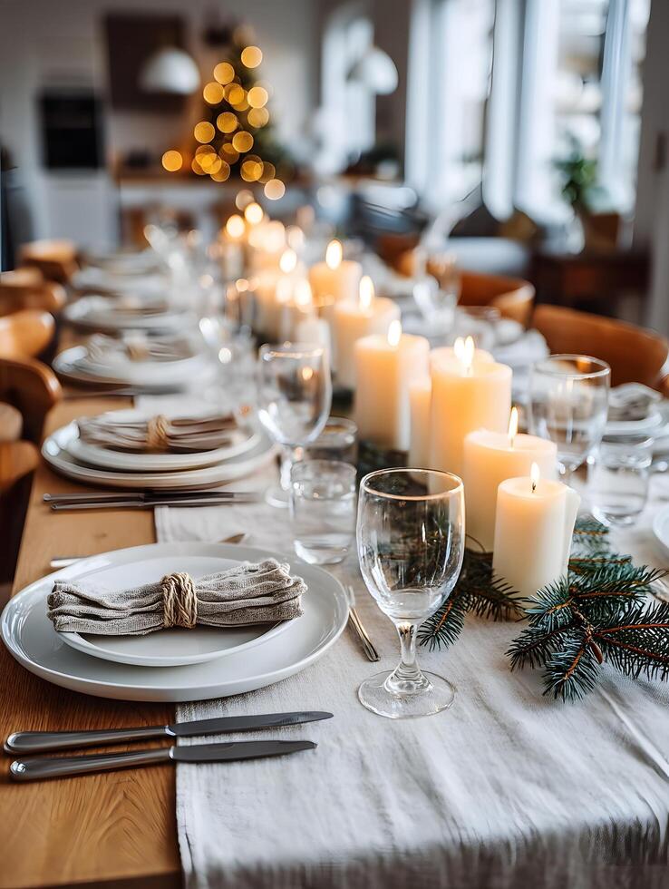 Elegant Christmas table setting with candles and pine branches photo