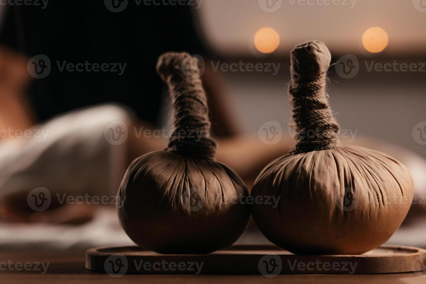 Thai Massage, asian woman in spa. Female having massage with herbal compress balls in therapy spa salon. Blurred background. Banner photo