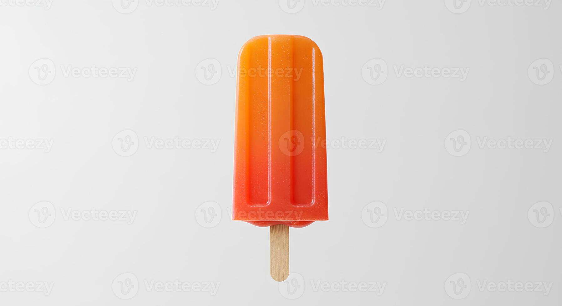 orange flavored popsicle isolated on white background with shadow. ice popsicle as treat during summertime heats. fruity dessert photo