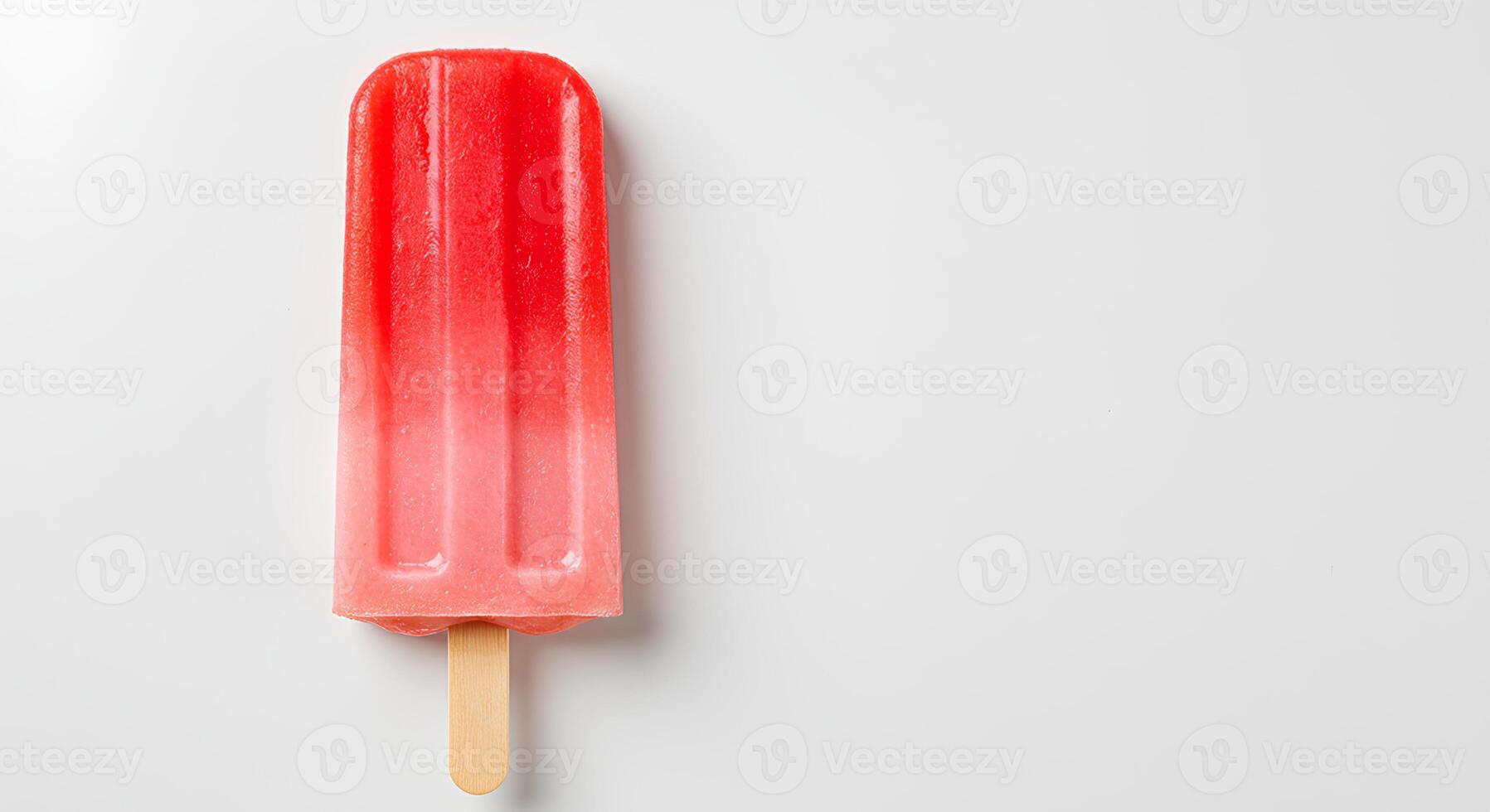 watermelon flavored popsicle isolated on white background with shadow. ice popsicle as treat during summertime heats. fruity dessert photo