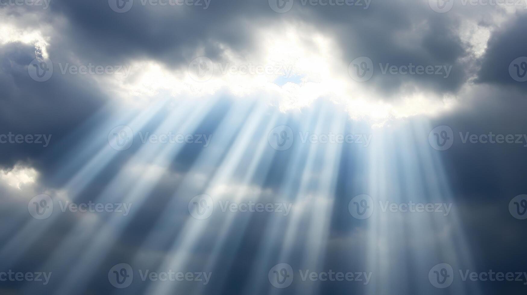 Divine Light Rays piercing through dramatic clouds creating a celestial spectacle photo