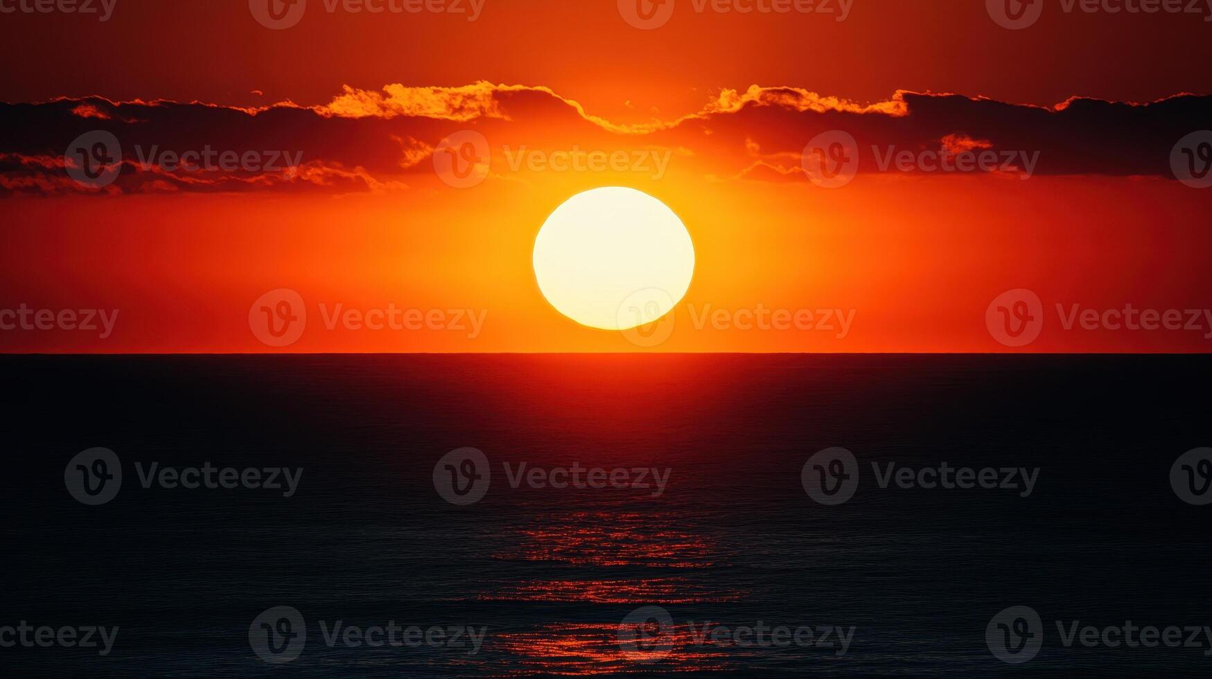 Oceanic Sunset A Fiery Sky Meets the Dark Waters Edge photo