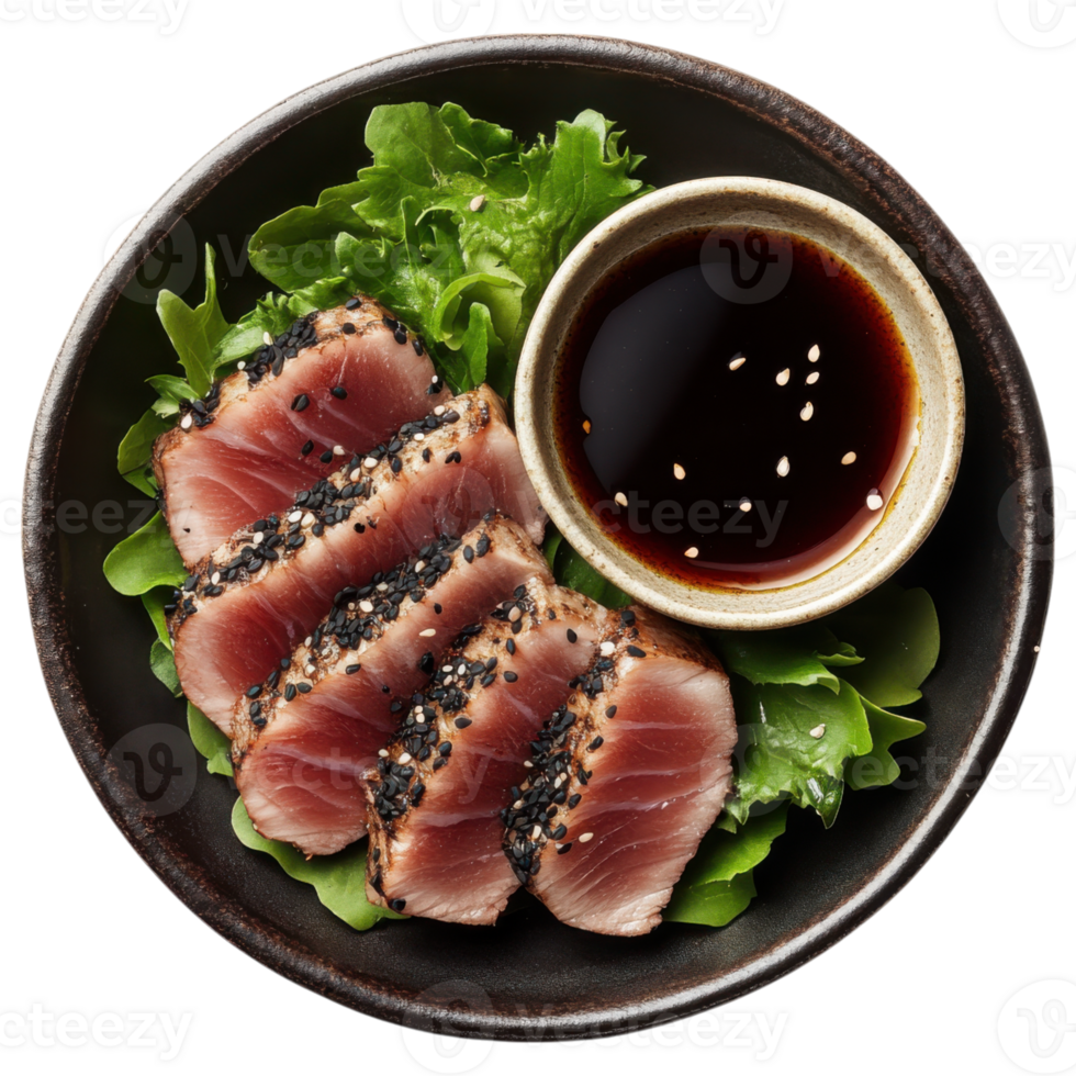 Seared tuna tataki with black sesame crust served on greens with sauce png