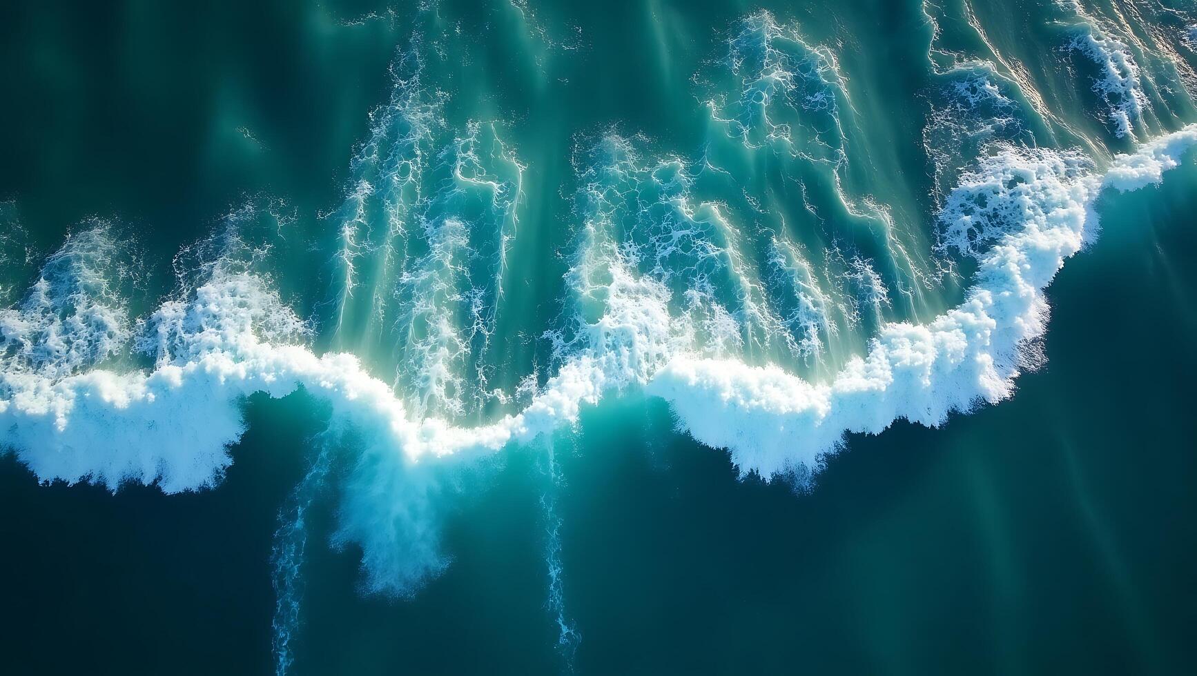 Stunning Aerial View of Ocean Waves Crashing Teal Water photo