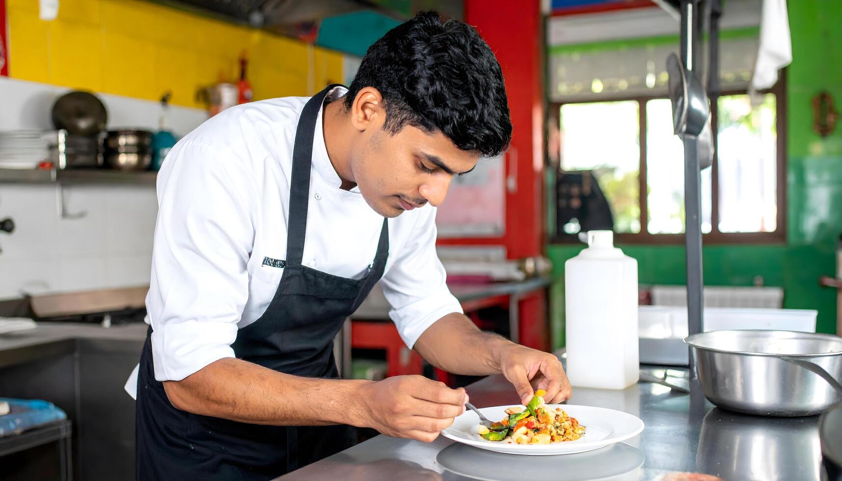 A talented Latin American chef preparing and presenting a traditional Latin American dish with care and skill in a lively kitchen photo