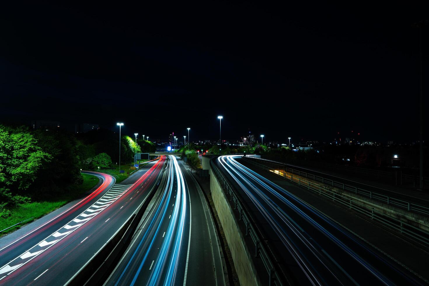 07-05-2025 Leeds, United Kingdom. Light trails illuminating Leeds ring road at night photo