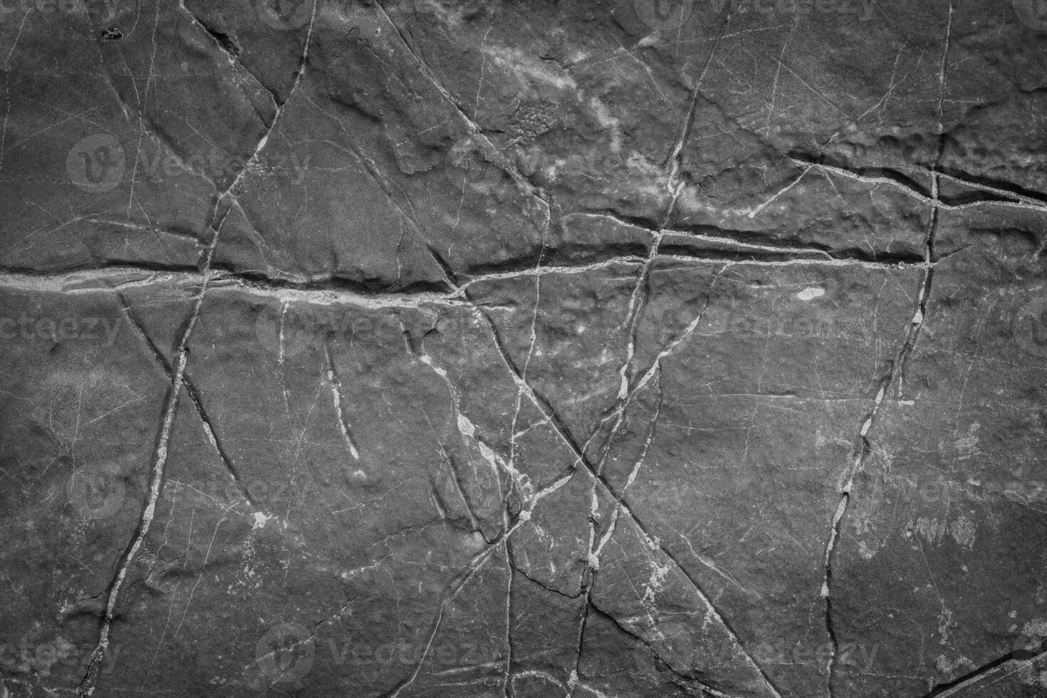 Textured Gray Stone Surface with Natural Cracks and Lines for Background or Design Elements photo