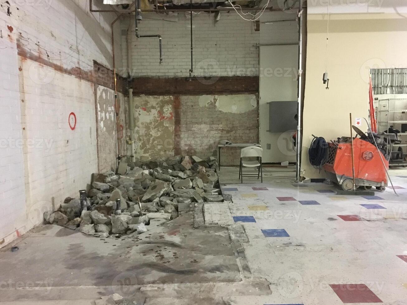 A Retail Store Having a Big Remodel with Torn Up Concrete Floor photo