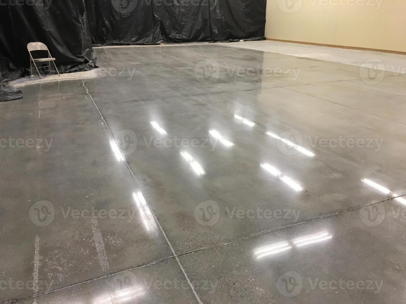 Shiny Fluorescent Light Reflections on Newly Polished Concrete Floor photo