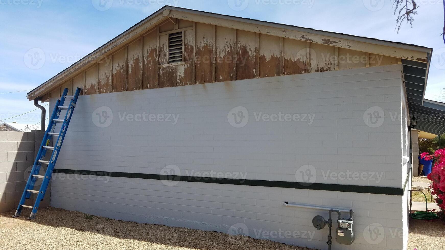 Removing Flaky Peeling Paint on Upper Wood, Preparing to Paint a House Exterior photo