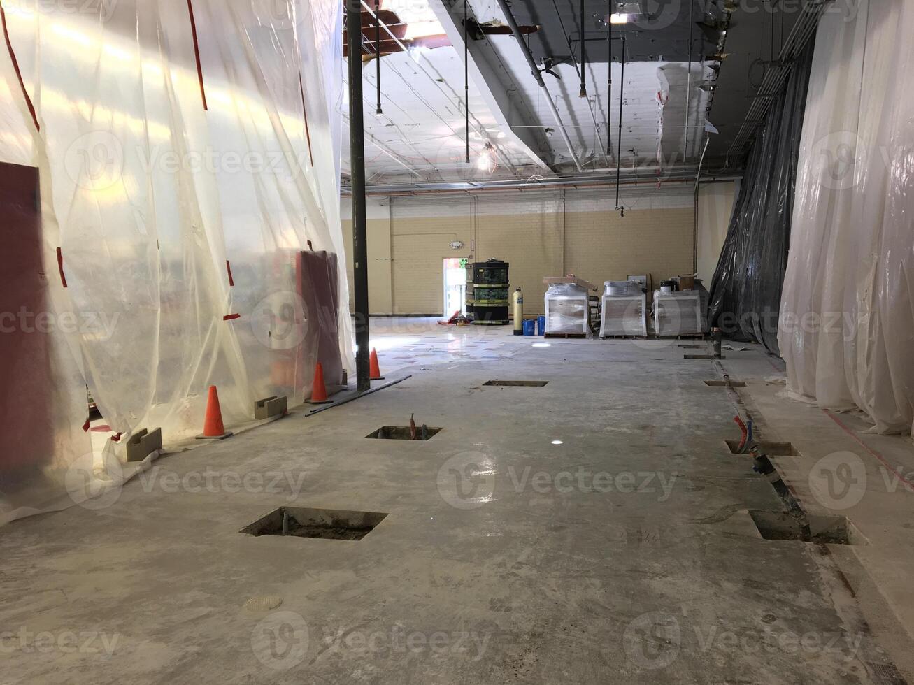 A Retail Store Having a Big Remodel with Plastic Partitions Hanging from Ceiling photo