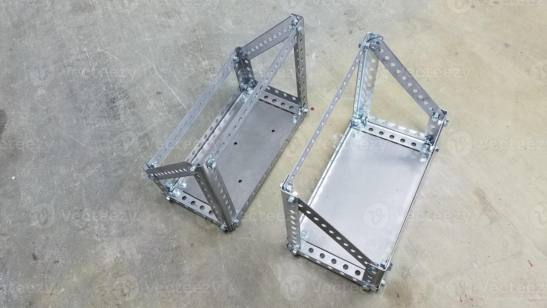 Top View of Two Custom Metal Gas Can Holders Made from Steel Perforated Angle photo
