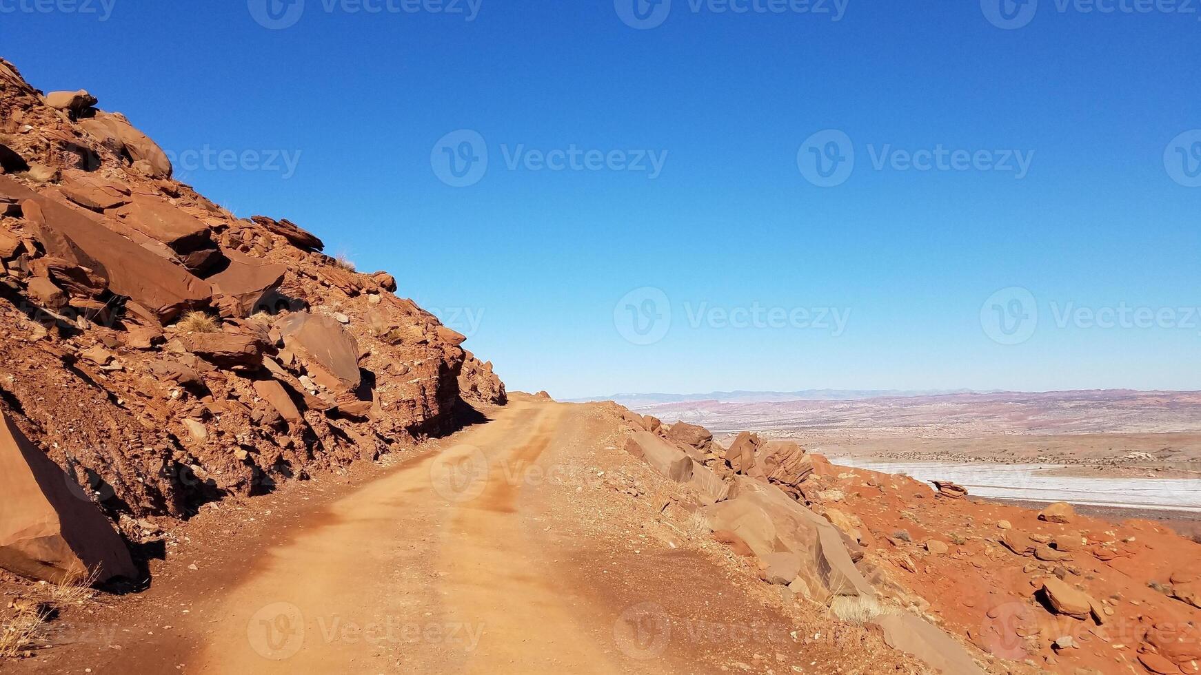 Off-road 4x4 Driving on Gemini Bridges Road Near Edge of a Cliff, Moab, Utah photo