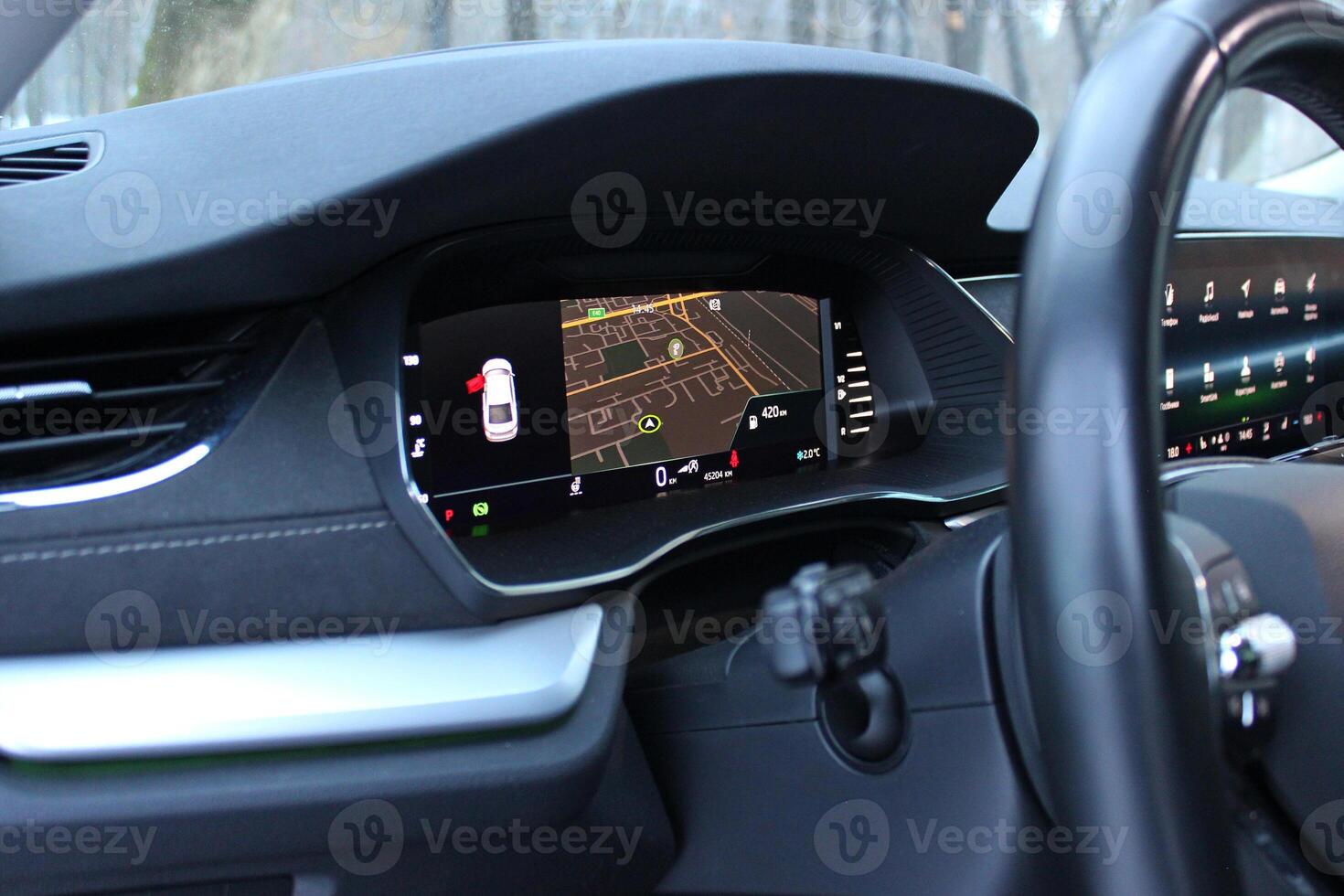 Side Angle View Of Navigation Map With Destination Point On A Modern Car Dashboard photo