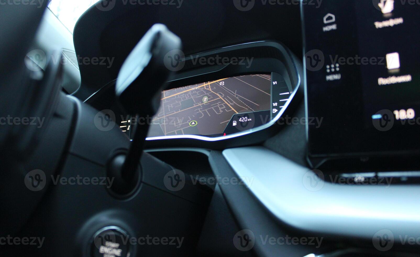 Bottom view from under the steering wheel of GPS map is displayed on the car dashboard photo