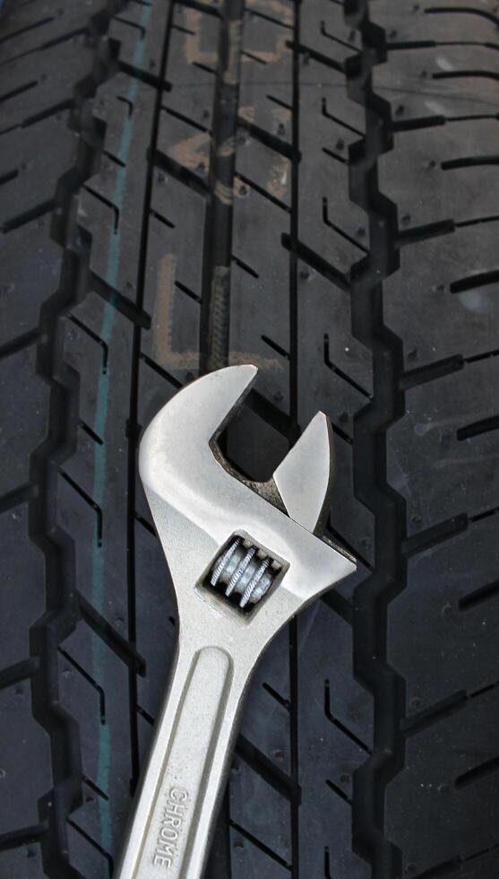 Adjustable Wrench For Wheel Mounting On A Car Tire Surface photo